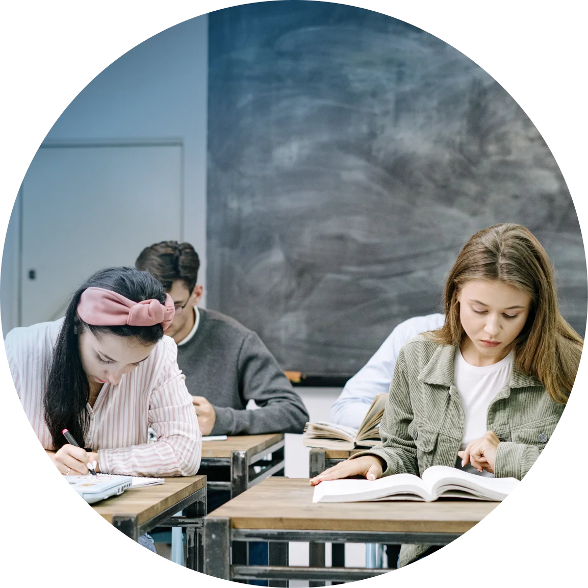 Students studying together at classroom desks